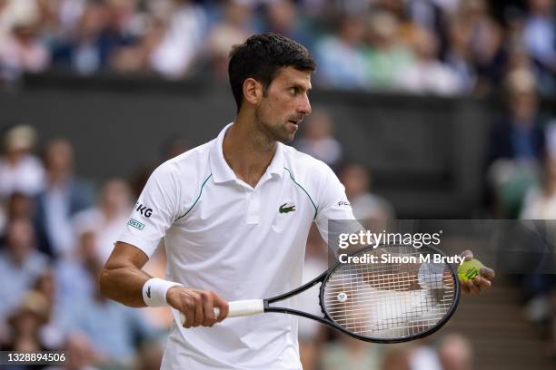 Novak Djokovic of Serbia in action during the Men's Singles Final against Matteo Berrettini of Italy at The Wimbledon Lawn Tennis Championship at the...