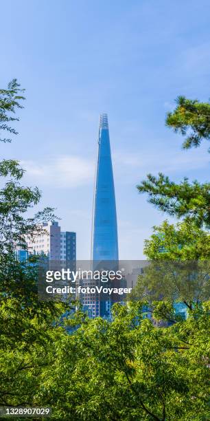 seoul futuristic spire of lotte world tower overlooking sincheon korea - lotte world tower stock pictures, royalty-free photos & images
