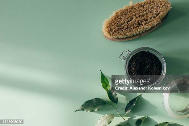 body scrub of coffee, oil in glass jar. top view. homemade cosmetic for peeling and spa care. flat lay. - detox bildbanksfoton och bilder