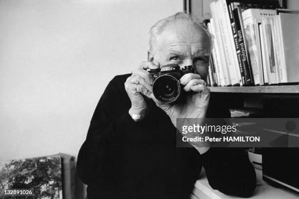 Photographer Robert Doisneau with his Leica camera at home during 1992 in Montrouge, Hauts de Seine, France.