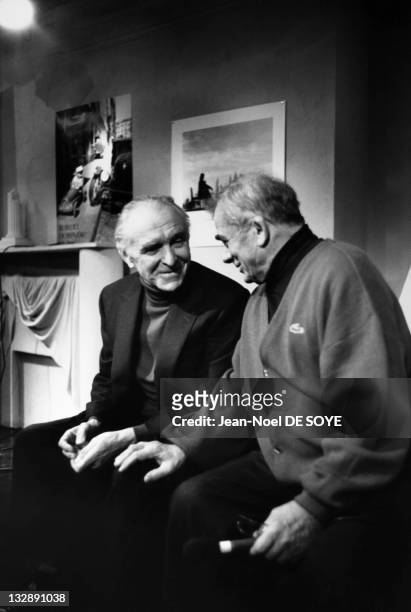 Photographer Robert Doisneau and actor Maurice Baquet on the set of TV show 'Du Cote De Chez Fred', during 1988, in Paris, France.