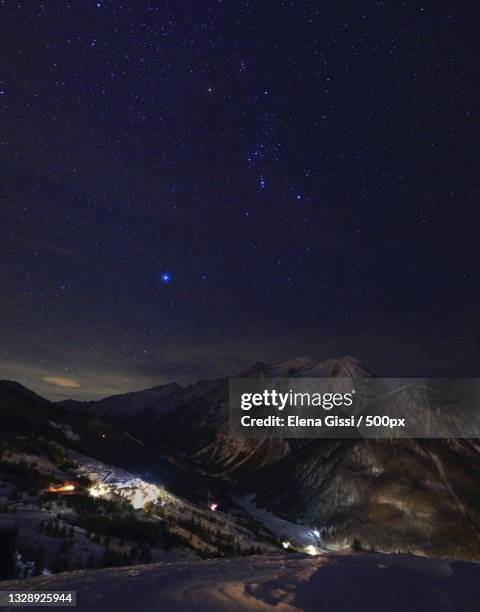 scenic view of mountains against sky at night,sestriere,turin,italy - sestriere stock-fotos und bilder