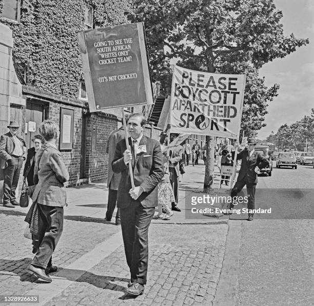 Demonstration outside Lord's Cricket Ground in London during the First Test between England and South Africa, UK, 24th July 1965. They are asking...