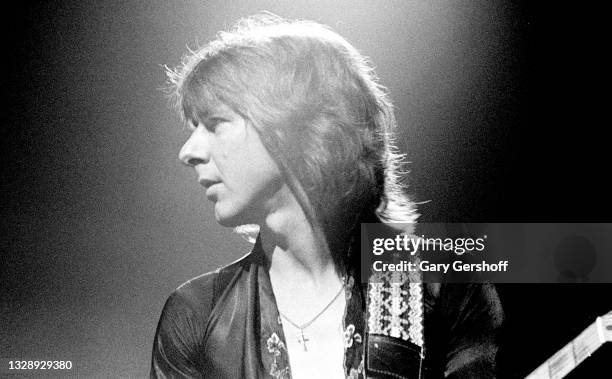 View of English Rock & Blues musician Mick Ralphs, of the band Bad Company, plays guitar as he performs, during the 'Desolation Angels' tour, onstage...