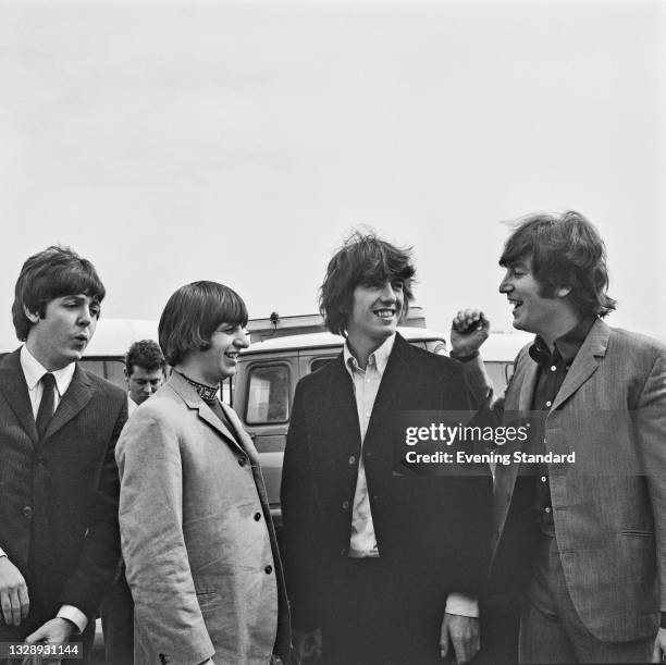 British rock group the Beatles at London Airport , UK, 13th August 1965. They are on their way to the United States for a US tour. From left to...