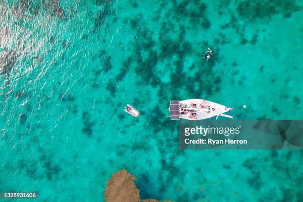 aerial over sailboat along coastline - magens bay stock pictures, royalty-free photos & images