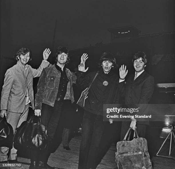 From left to right, musicians Ringo Starr, John Lennon, George Harrison and Paul McCartney of English pop group the Beatles at London Airport , UK,...