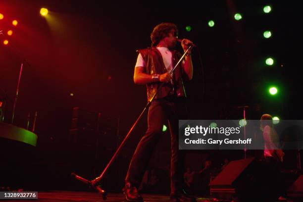 View of English Rock & Blues musician Paul Rodgers, of the band Bad Company, on vocals as he performs, during the 'Desolation Angels' tour, onstage...