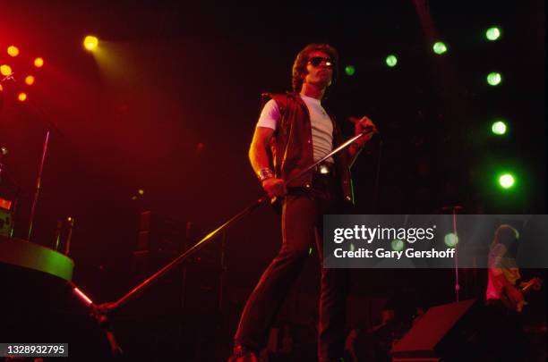 View of English Rock & Blues musician Paul Rodgers, of the band Bad Company, on vocals as he performs, during the 'Desolation Angels' tour, onstage...