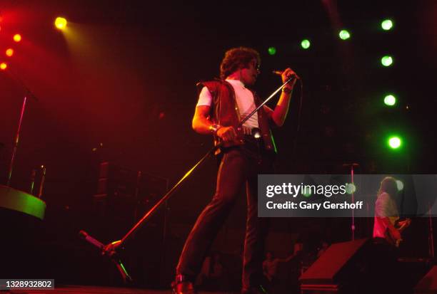 View of English Rock & Blues musician Paul Rodgers, of the band Bad Company, on vocals as he performs, during the 'Desolation Angels' tour, onstage...