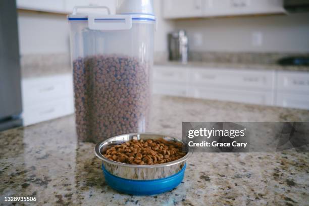 pet food and bowl on kitchen counter - dog food stock pictures, royalty-free photos & images