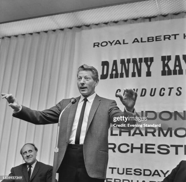 American actor, singer, dancer and comedian Danny Kaye holds a press call to promote his upcoming concert at the Royal Albert Hall in London, where...