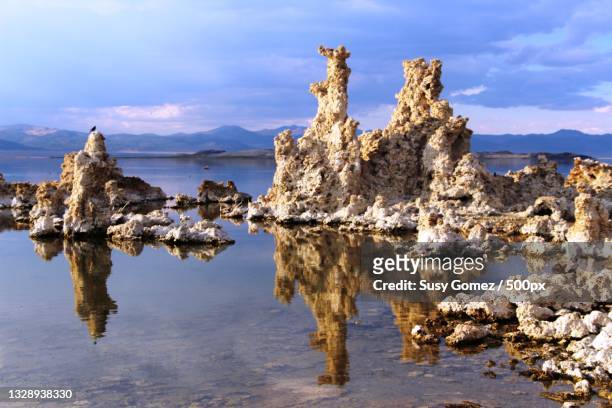 panoramic view of rocks on beach against sky,mono lake,united states,usa - tufa stock pictures, royalty-free photos & images