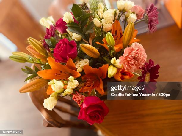 midsection of bride holding bouquet - fall flowers home stock pictures, royalty-free photos & images