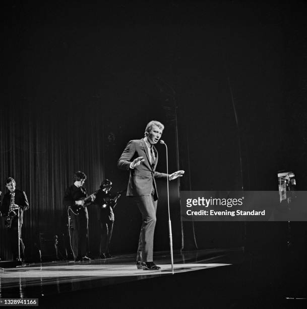French pop singer Johnny Hallyday on stage at the Royal Command Performance or Royal Variety Performance at the London Palladium, London, UK, 8th...