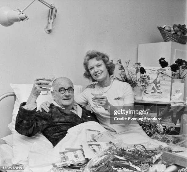 British film producer and director Herbert Wilcox with his third wife, actress Anne Neagle , UK, 16th December 1965.