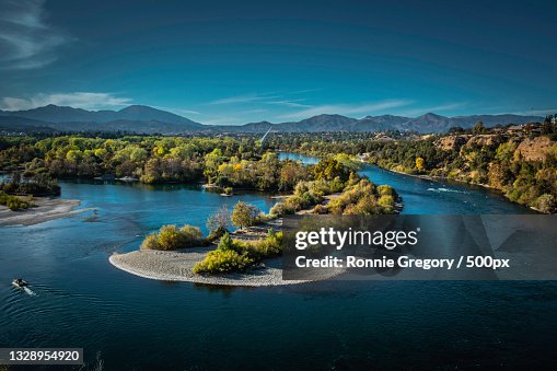 Scenic view of river by mountains against sky,Redding,California,United States,USA