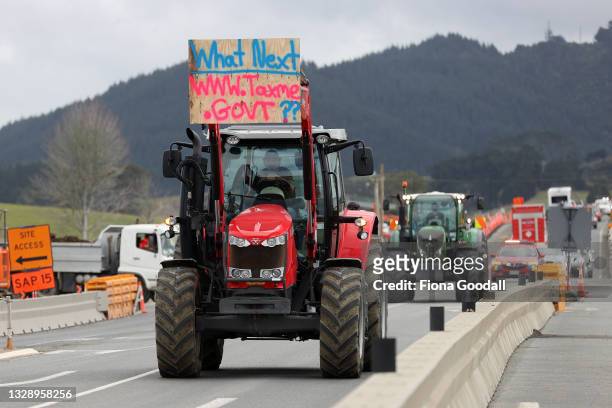Farmers and tradies drive in a protest convoy through Warkworth on July 16, 2021 in Auckland, New Zealand. Farmers and rural residents are protesting...