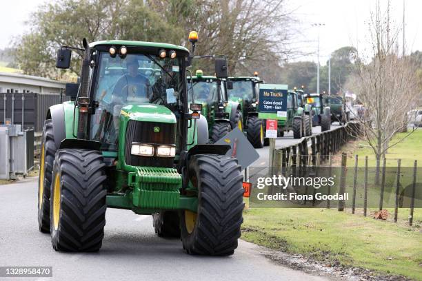 Farmers and tradies drive in a protest convoy through Warkworth on July 16, 2021 in Auckland, New Zealand. Farmers and rural residents are protesting...