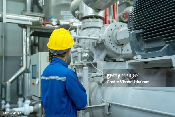 electrician engineer women with helmet checking electrical operating system in industrial. - escarpin à talon photos et images de collection