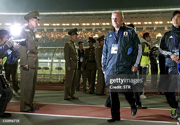Japan's national football team head coach Alberto Zaccheroni leaves the pitch after Japan lost the World Cup 2014 qualifying match in Pyongyang on...