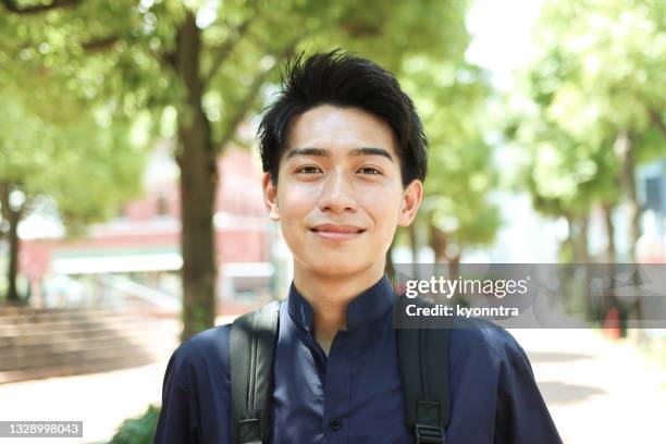 portrait of young asian man - young face serious at camera stock pictures, royalty-free photos & images