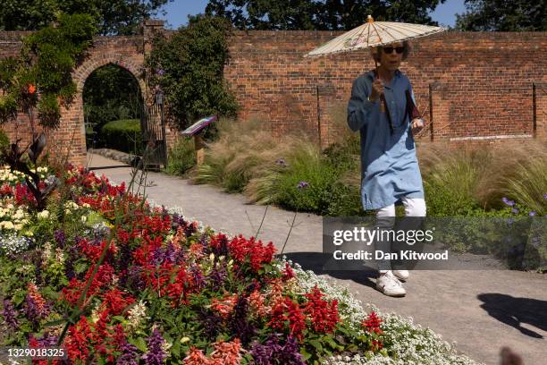 An elderly group walk along the herbaceous border in the gardens at Beckenham Place Park on July 16, 2021 in Beckenham, England.