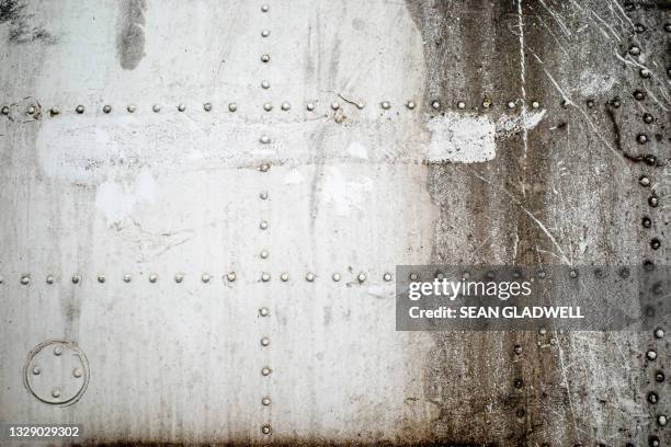 oil stained steel plate - rivet stock pictures, royalty-free photos & images