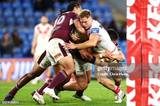 Jack De Belin of the Dragons is tackled during the round 18 NRL match between the Manly Sea Eagles and the St George Illawarra Dragons at Cbus Super...