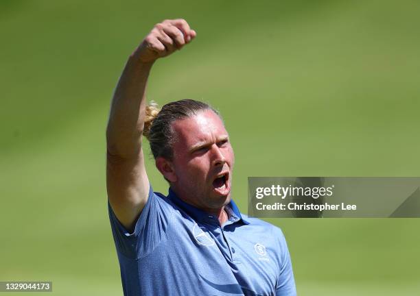 Marcel Siem of Germany celebrates his putt on the 18th hole during Day Two of The 149th Open at Royal St George’s Golf Club on July 16, 2021 in...