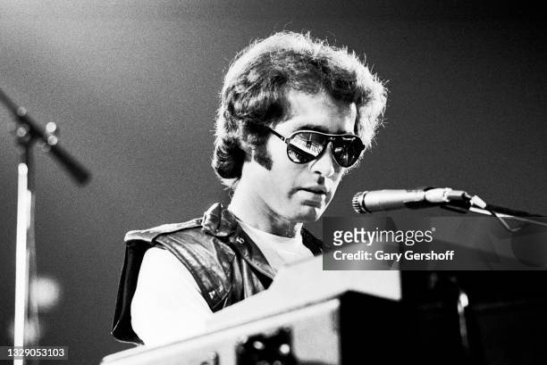 View of English Rock & Blues musician Paul Rodgers, of the band Bad Company, on vocals and keyboards as he performs, during the 'Desolation Angels'...