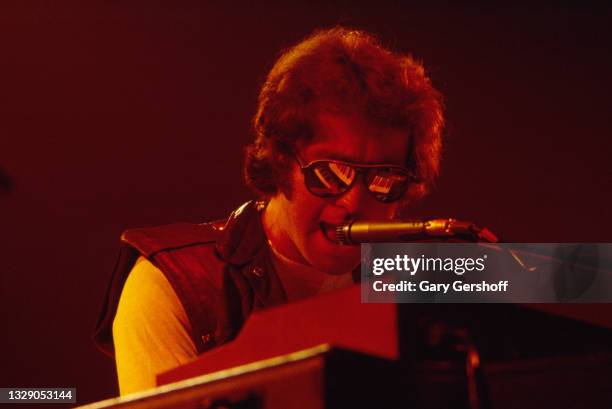 View of English Rock & Blues musician Paul Rodgers, of the band Bad Company, on vocals and keyboards as he performs, during the 'Desolation Angels'...