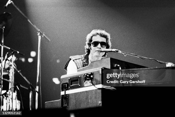 View of English Rock & Blues musician Paul Rodgers, of the band Bad Company, on vocals and keyboards as he performs, during the 'Desolation Angels'...