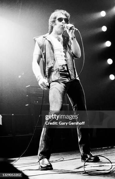 View of English Rock & Blues musician Paul Rodgers, of the band Bad Company, on vocals as he performs, during the 'Desolation Angels' tour, onstage...