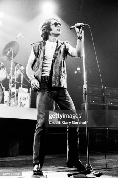 View of English Rock & Blues musician Paul Rodgers, of the band Bad Company, on vocals as he performs, during the 'Desolation Angels' tour, onstage...