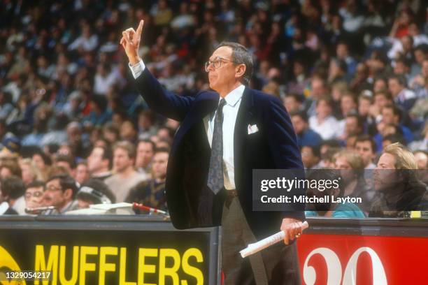 Head coach Larry Brown of the San Antonio Spurs signals to his players during a NBA basketball game against the Washington Bullets at the Capital...