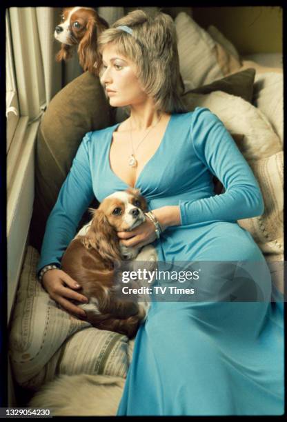 Actress Stephanie Beacham photographed with her two King Charles Spaniels, circa 1974.
