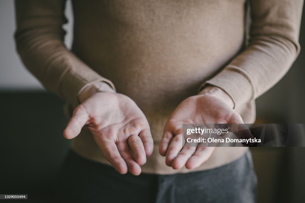 Man offer two hands and holding nothing