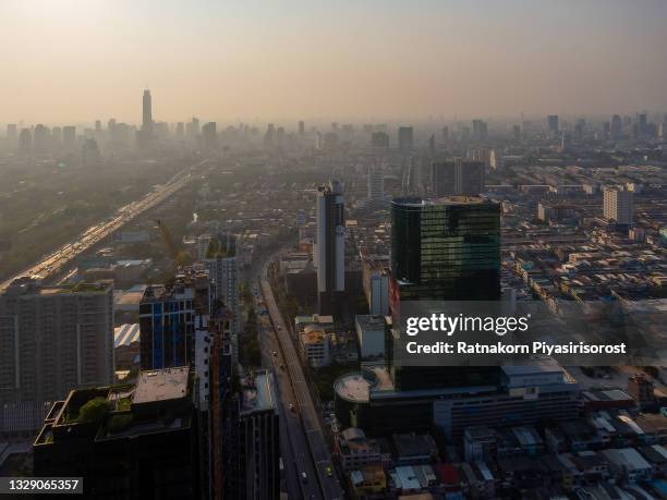 drone aerial view of downtown capital city high rise building financial district bangkok thailand - bts skytrain stock pictures, royalty-free photos & images