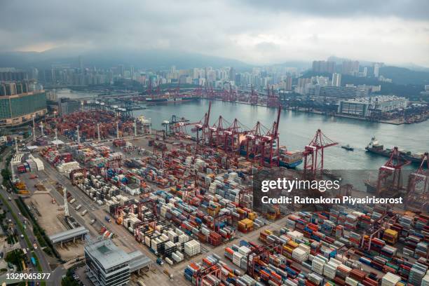 aerial drone view of container cargo freight ship terminal in hong kong - hong kong harbour stockfoto's en -beelden