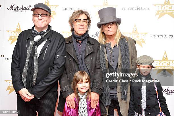 Rick Nielsen, Tom Petersson and Robin Zander of Cheap Trick arriving on the red carpet for the Classic Rock Awards, taken on November 10, 2010.