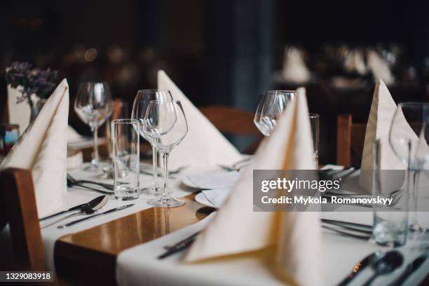 stylishly served table in the cozy restaurant - cubierto completo fotografías e imágenes de stock