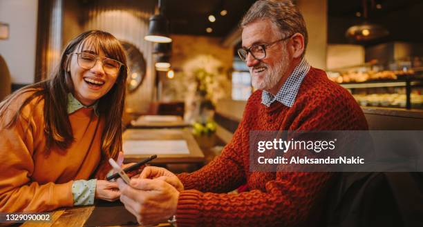 coffee break with dad - baby boomer and millennial stock pictures, royalty-free photos & images