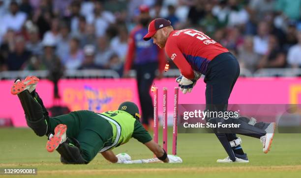 Pakistan batsman Imad Wasim is run out by wicketkeeper Jonny Bairstow during the 1st T20 match between England and Pakistan at Trent Bridge on July...