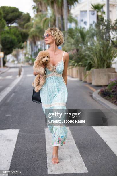 Stella Manente is seen wearing her collection of hats during the 74th annual Cannes Film Festival at on July 16, 2021 in Cannes, France.