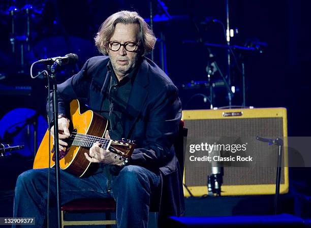 English musician Eric Clapton performing live on stage with his signature Martin 000-28EC acoustic guitar at the O2 Arena on February 13, 2010 in...