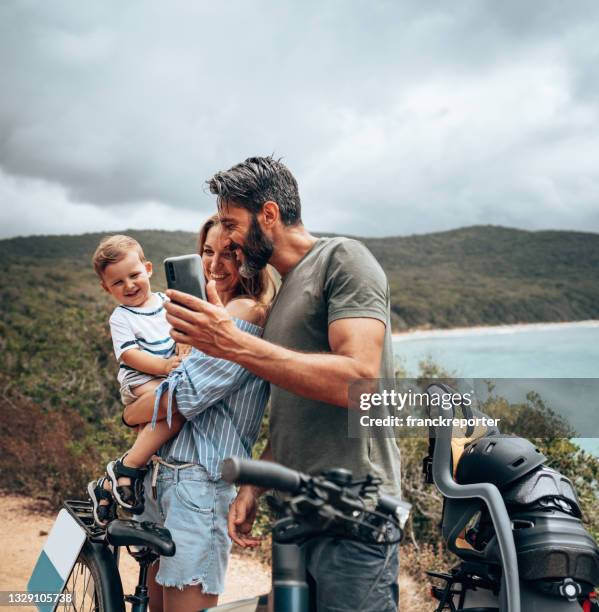 happy bikers family take a selfie - family nature phone stock pictures, royalty-free photos & images