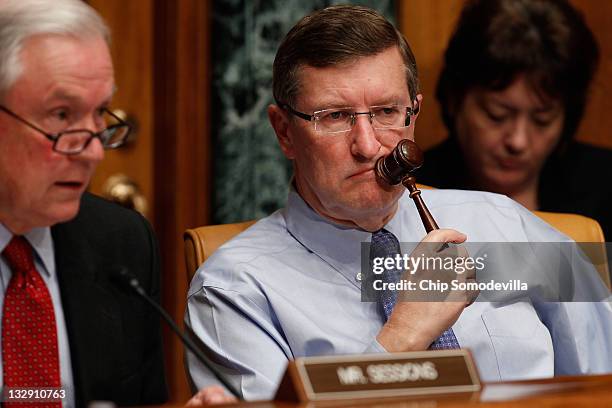 Senate Budget Committee Chairman Sen. Kent Conrad listens to ranking member Sen. Jeff Sessions question Congressional Budget Office Director Doug...