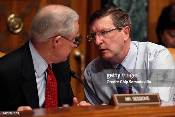 Senate Budget Committee Chairman Sen. Kent Conrad speaks with ranking member Sen. Jeff Sessions during a hearing on Capitol Hill November 15, 2011 in...