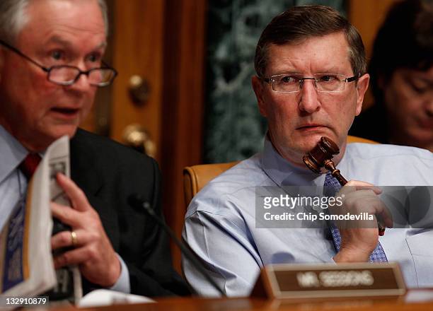 Senate Budget Committee Chairman Sen. Kent Conrad listens to ranking member Sen. Jeff Sessions question Congressional Budget Office Director Doug...